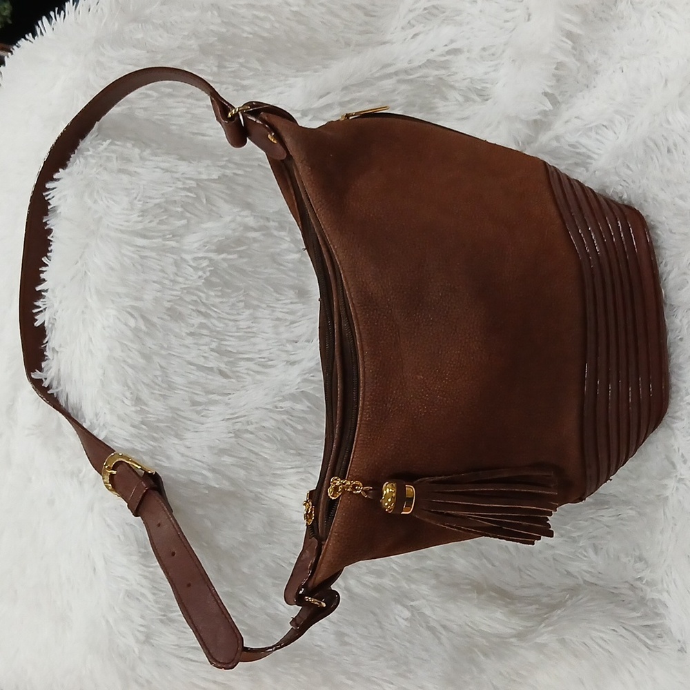 Tignanello Brown Textured Purse With Gold Accents And Tassels.
